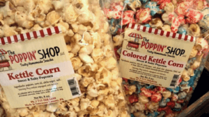 Two bags of popcorn, one plain and one colored kettle corn.