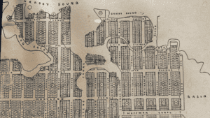 Vintage map of a city grid with labeled streets and blocks.
