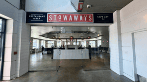 Entrance of Stowaways restaurant with clear signage and spacious interior.
