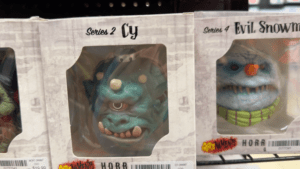 A cyborg cyclops toy in a box labeled 'Series 2 Cy'.