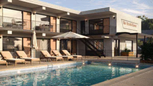 Modern house with a swimming pool and lounge chairs.