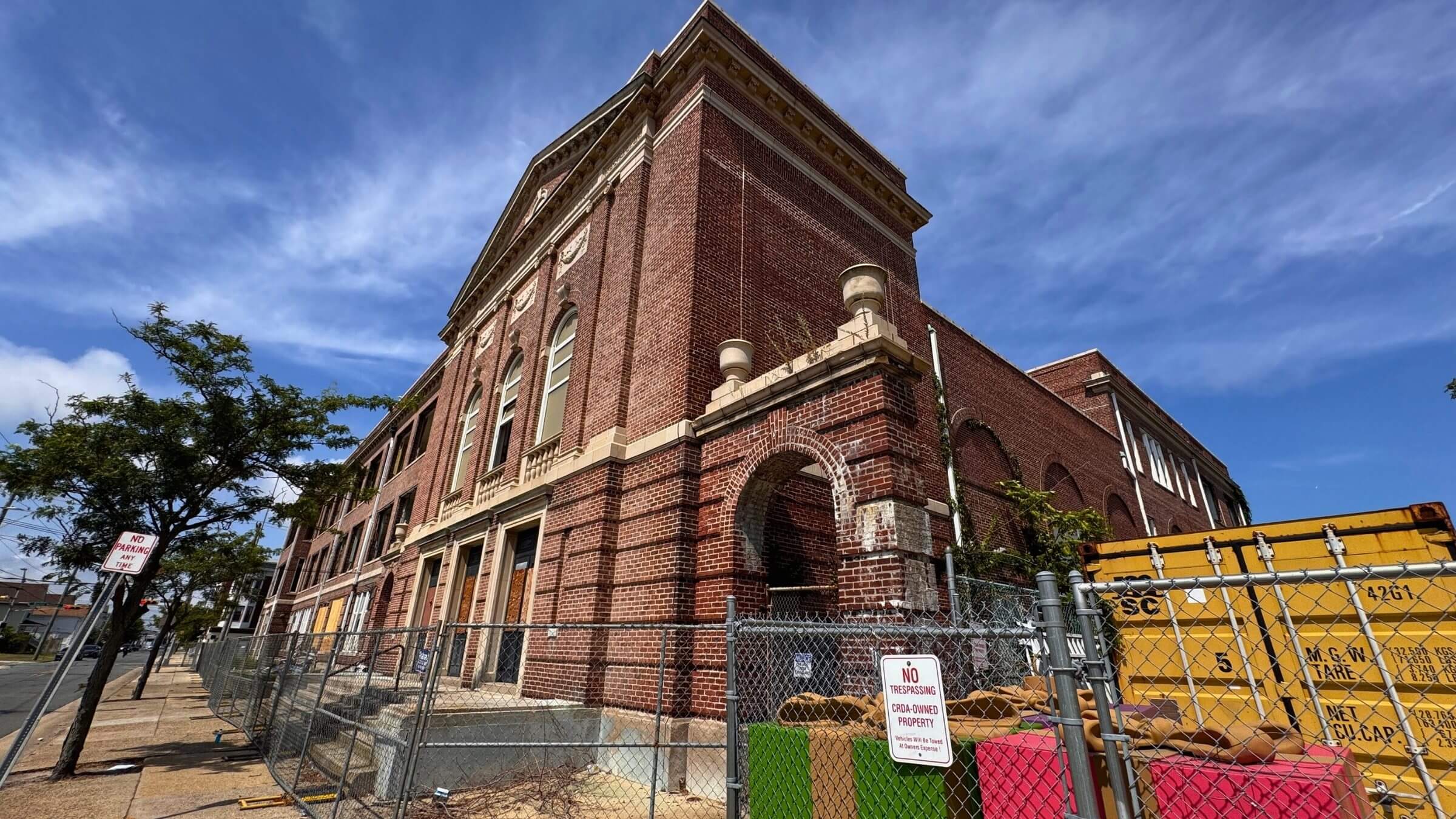 Historic brick building under blue sky.